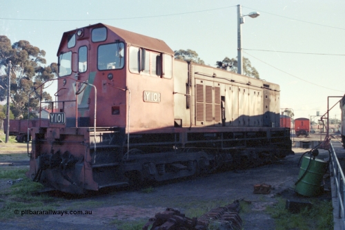 147-22
Seymour loco depot, standard gauge V/Line shunt loco Clyde Engineering built EMD model G6B serial 63-291 and class leader for the Y class Y 101 sits on the standard gauge turntable road, these units ride on former 'Swing Door' motor bogies.
Keywords: Y-class;Y101;Clyde-Engineering-Granville-NSW;EMD;G6B;63-291;