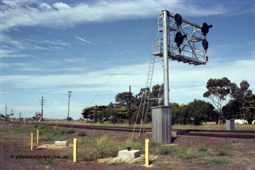 149-05
Rockbank, view of cantilevered signal post with searchlight signals 12 (No. 2 Road) and 10 (No. 1 Road) Up Home Signals, train control telephone booth and wire stays in foreground.
