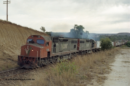 149-25
Bacchus Marsh, V/Line C class locos C 508 Clyde Engineering EMD model GT26C serial 76-831 and C 5?? Power a Melbourne bound 9150? Goods train away from the Marsh at Frisken St, the distant signal can be seen above the trailing C class.
