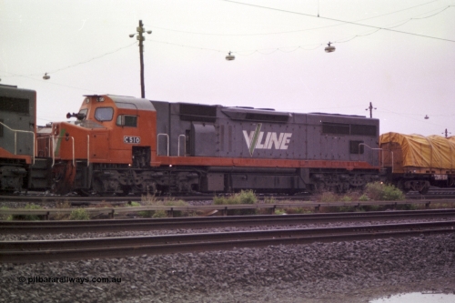 150-02
Tottenham yard, V/Line broad gauge C class loco C 510 Clyde Engineering EMD model GT26C serial 76-833 is 2nd unit on Adelaide bound goods train 9169 in rain as departure time approaches, side view.
Keywords: C-class;C510;Clyde-Engineering-Rosewater-SA;EMD;GT26C;76-833;