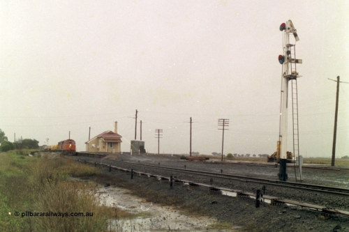150-09
Gheringhap, station overview, point rodding and interlocking, semaphore signal post four pulled off for train 9169 to depart on the Maroona line, broad gauge V/Line C classes Clyde Engineering EMD model GT26C on the lead.
