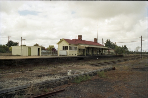 153-1-07
Ballan station overview, station shed on platform, signal box and station building, taken from goods shed platform.
