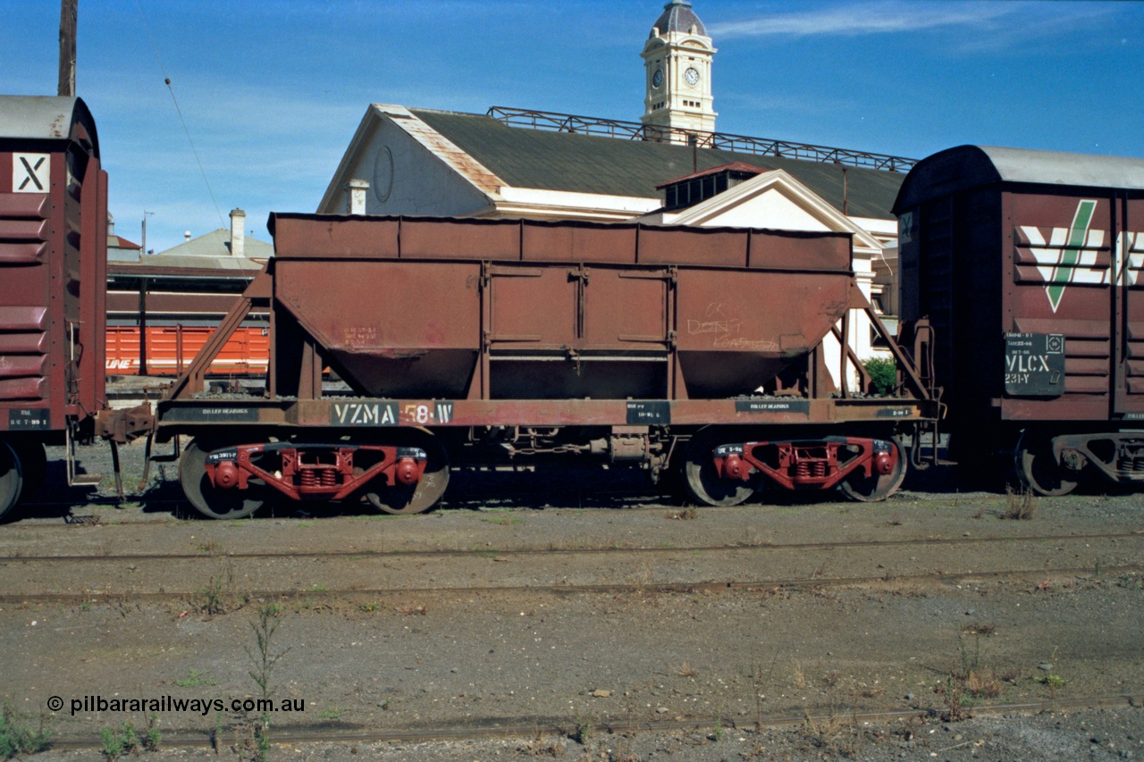 153-2-16
Ballarat station yard, broad gauge V/Line VZMA type bogie ballast waggon VZMA 58 with new bogies, originally built by Victorian Railways Newport Workshops as an NN type ballast hopper in August 1950, recoded to VHWA in 1979, station canopy and clock tower behind.
Keywords: VZMA-type;VZMA58;Victorian-Railways-Newport-WS;NN-type;VZWA-type;