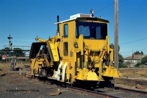 153-2-36
Ararat station yard, ballast regulator, signal gantry for mainline behind in background.
