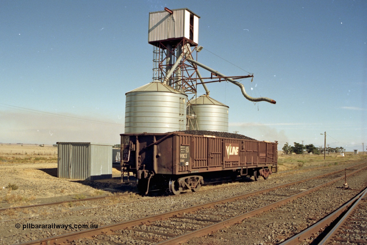 153-3-01
Maroona, V/Line VOCX type bogie open waggon VOCX 130, originally built by Victorian Railways Ballarat North Workshops an ELX type in July 1968, recoded to VOCX in 1979, loaded with briquettes at the silo load out, lever handbrake.
Keywords: VOCX-type;VOCX130;Victorian-Railways-Ballarat-Nth-WS;ELX-type