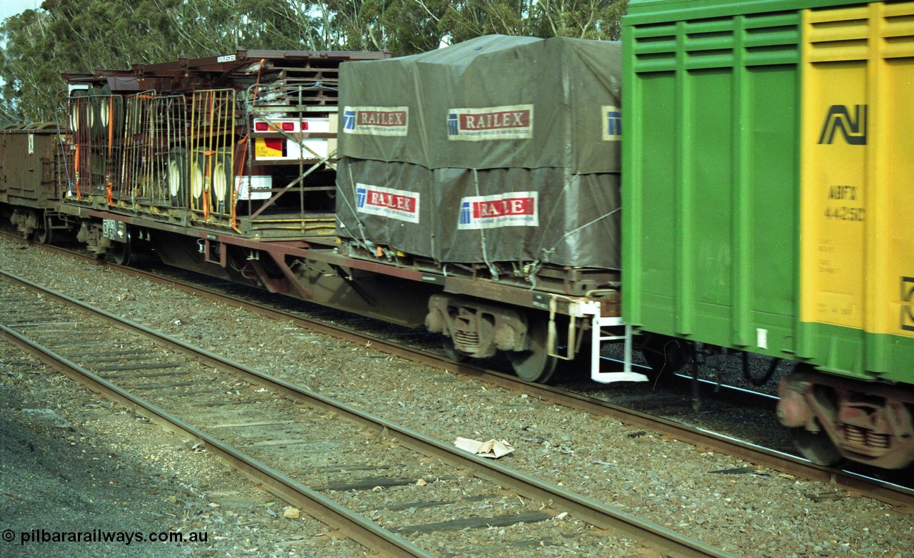 154-23
Lismore, V/Line broad gauge bogie 60 foot container flat waggon with FCL skel trailers on board.
