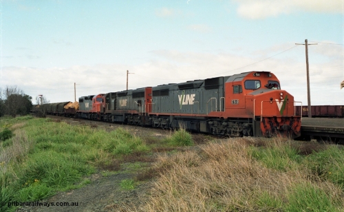 154-03
Gheringhap, V/line broad gauge goods train 9169 to Adelaide, via Cressy pauses at the station platform, triple C class locos leading, C 510 Clyde Engineering EMD model GT26C serial 76-833 leads C 508 serial 76-831 and C class leader C 501 'George Brown' serial 76-824, VOJF type bogie gypsum waggon in background, taken from former No.2 platform.
Keywords: C-class;C510;Clyde-Engineering-Rosewater-SA;EMD;GT26C;76-833;