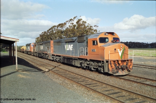 154-14
Lismore, V/Line broad gauge C class locomotive C 510 Clyde Engineering EMD model GT26C serial 76-833 leads Adelaide bound goods train 9169 with C 508 serial 76-831 and C class leader C 501 'George Brown' serial 76-824, paused on No.2 Rd opposite the station building to obtain a new train order from Lismore to Ararat.
Keywords: C-class;C510;Clyde-Engineering-Rosewater-SA;EMD;GT26C;76-833;