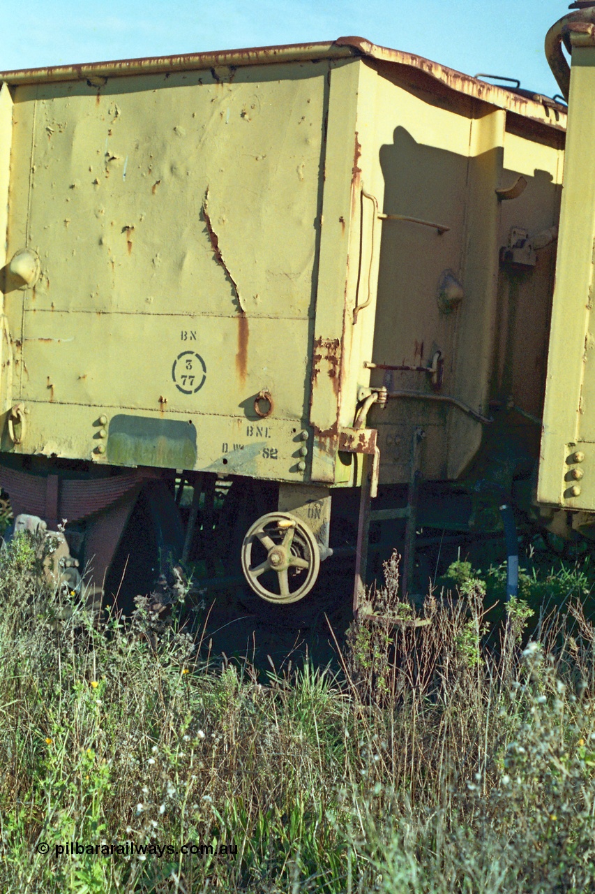 155-09
Wallan, stored 'OFF REG' waggon awaiting scrapping, four wheel waggon, GY type open waggon GY 960, detail view of hand brake wheel and shunters step.
Keywords: GY-type;GY960;fixed-wheel-waggon;