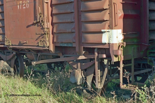 155-05
Wallan, stored 'OFF REG' waggon awaiting scrapping, four wheel waggon, short U type louvre van U 1726, detail view of lever foot brake, shunters step and door locking mechanism.
Keywords: U-type;U1726;fixed-wheel-waggon;
