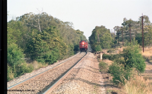159-02
Bank Box Loop, V/Line broad gauge A class locomotive leads a down passenger train near the grade crossing west of the crossing loop.

