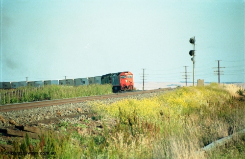 159-03
Bank Box Loop, distant view of a down Adelaide bound broad gauge goods train rounding the curve with the super elevation of the mainline visible being hauled by V/Line G class G 540 Clyde Engineering EMD model JT26C-2SS serial 89-1273 and Australian National 700 class 704 AE Goodwin ALCo model DL500G serial G6059-2.
Keywords: G-class;G540;Clyde-Engineering-Somerton-Victoria;EMD;JT26C-2SS;89-1273;