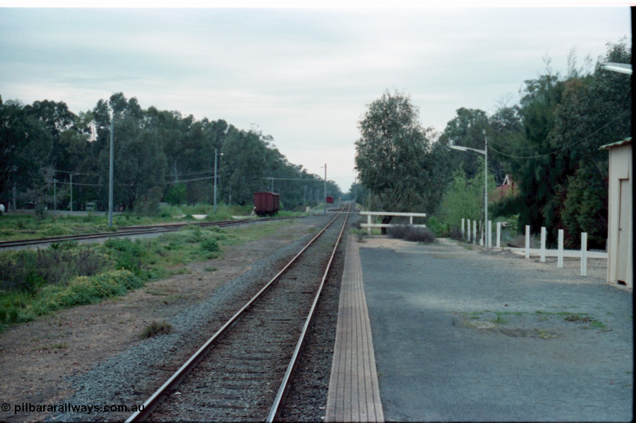 160-15
Mooroopna, view from station platform looking towards Shepparton, bogie louvre van sitting in the former stock yards siding, while another van is in the distance near the Goulburn River bridge.
