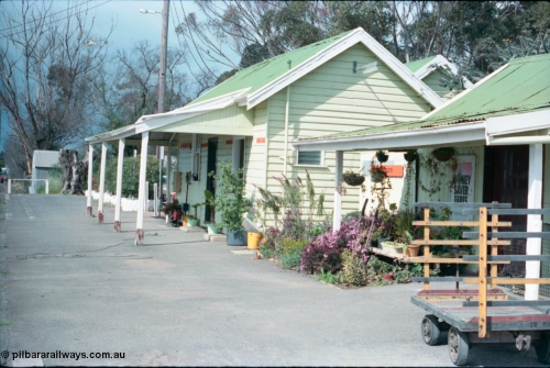 161-20
Cobram, station platform and building overview, show well maintained garden, luggage trolley, the way we were.

