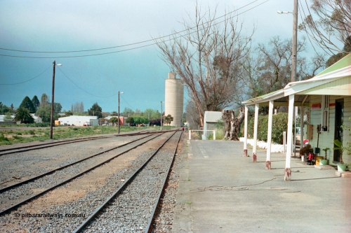 161-21
Cobram, yard overview looking north from station platform, Williamstown style silo complex in the background, station building at right.
