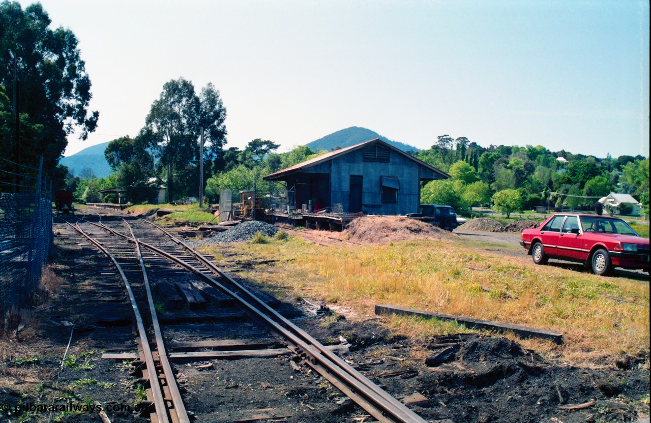 162-1-14
Healesville, yard overview looking north goods shed on the right, station building and platform in the distance, loco compound at right.
