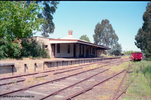162-1-10
Healesville, station yard view looking south, station building and platform, yard overview, freshly repainted GY type four wheel waggon in yard.
