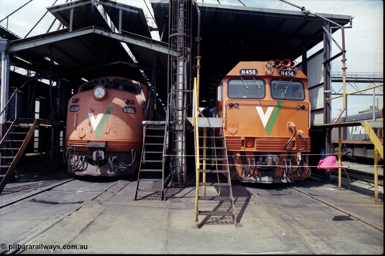 162-2-02
South Dynon Motive Power Depot broad gauge fuel point, V/Line diesel electric locomotives 'on shed' are new and re-build passenger train motive power in the form of Bulldog A class A 73 Clyde Engineering EMD model AAT22C-2R serial 83-1179 rebuilt from B class B 73 Clyde Engineering EMD model ML2 serial ML2-14, and N class N 458 'City of Maryborough' Clyde Engineering EMD model JT22HC-2 serial 85-1226 front view at the fuel point.
Keywords: A-class;A73;Clyde-Engineering-Rosewater-SA;EMD;AAT22C-2R;83-1179;rebuild;bulldog;N-class;N458;JT22HC-2;85-1226;