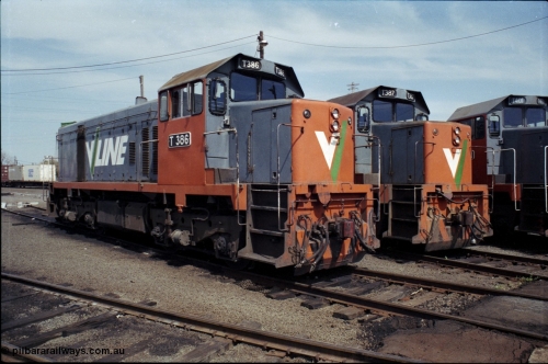 162-2-25
South Dynon Motive Power Depot, broad gauge turntable radial roads, V/Line diesel electric locomotives T class T 386 Clyde Engineering EMD model G8B serial 64-341, T 387 serial 65-417 and obscured T 401 Clyde Engineering EMD model G18B serial 67-496, PTC Open Day.
Keywords: T-class;T386;Clyde-Engineering-Granville-NSW;EMD;G8B;64-341;