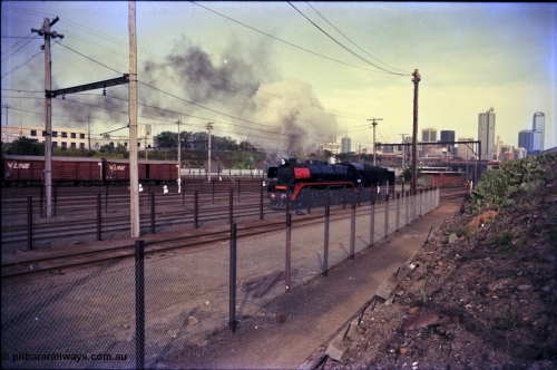 162-3-18
Melbourne Yard, Steamrail R class R 761 North British Locomotive Company, Glasgow, Scotland model Hudson serial 27051 reverses back to Spencer Street having run around the reversing loop, PTC Open Day.
Keywords: R-class;R761;North-British-Locomotive-Company;Hudson;27051;