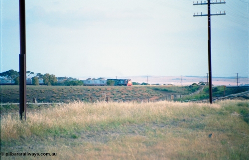 163-01
Bank Box Loop, broad gauge down V/Line Adelaide bound good train rounding the curve on approach behind a third series X class and Australian National BL class.
