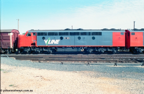 163-07
Seymour station yard, stabled V/Line down broad gauge Wodonga goods train in the rationalised yard behind the classic back to back pair of streamlined Bulldogs, S classes S 311 'Sir Ferdinand von Mueller' Clyde Engineering EMD model A7 serial 60-228 with a rake of louvre vans leading, side view.
Keywords: S-class;S311;Clyde-Engineering-Granville-NSW;EMD;A7;60-228;bulldog;
