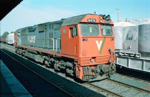 163-08
Seymour station yard, platform view, V/Line broad gauge N class loco N 474 'City of Traralgon' Clyde Engineering EMD model JT22HC-2 serial 87-1203 is stabled awaiting the Sunday night combined down Albury / Cobram passenger train which splits here with N 474 running to portion to Cobram, next to it is the tail end of a stabled down Wodonga goods train.
Keywords: N-class;N474;Clyde-Engineering-Somerton-Victoria;EMD;JT22HC-2;87-1203;