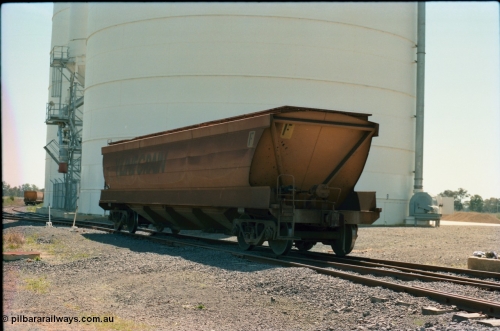 164-18
Murchison East, V/Line Grain VHGF type bogie grain waggon VHGF 119, built as a GJX type by Steelweld Victoria in January 1969, is loose shunted down the gravitational road loaded towards the loaded rake, rolling past the Ascom Jumbo silo complex, show non-handbrake end of waggon.
Keywords: VHGF-type;VHGF119;Steelweld-Vic;GJX-type;