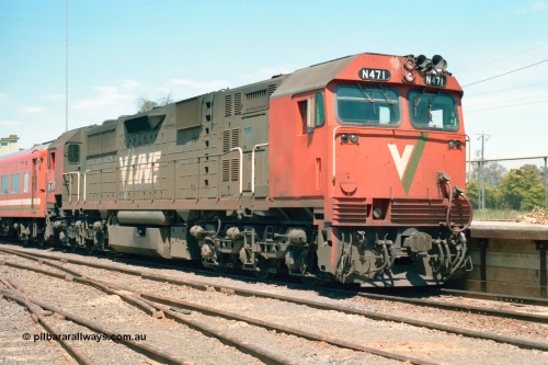 164-22
Murchison East, V/Line broad gauge N class loco N 471 'City of Benalla' Clyde Engineering EMD model JT22HC-2 serial 87-1200 with the down Cobram passenger train paused at the platform, tracks in foreground have seen recent re-sleepering and ballasting.
Keywords: N-class;N471;Clyde-Engineering-Somerton-Victoria;EMD;JT22HC-2;87-1200;