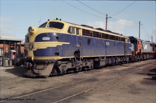 165-06
Wodonga loco depot, V/Line broad gauge Bulldog locomotive B class B 75 Clyde Engineering EMD model ML2 serial ML2-16 still in Victorian Railways livery, coupled to X class X 45 next to the fuel point.
Keywords: B-class;B75;Clyde-Engineering-Granville-NSW;EMD;ML2;ML2-16;bulldog;