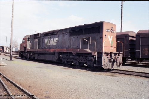 165-15
Albury loco depot, standard gauge V/Line C class locomotive C 504 Clyde Engineering EMD model GT26C serial 76-827 stands beside some NSWSRA NLDF class vans, trailing view.
Keywords: C-class;C504;Clyde-Engineering-Rosewater-SA;EMD;GT26C;76-827;