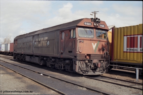 165-17
Albury loco depot, standard gauge V/Line G class unit G 522 Clyde Engineering EMD model JT26C-2SS serial 86-1235 stands next to a stabled goods train.
Keywords: G-class;G522;Clyde-Engineering-Rosewater-SA;EMD;JT26C-2SS;86-1235;