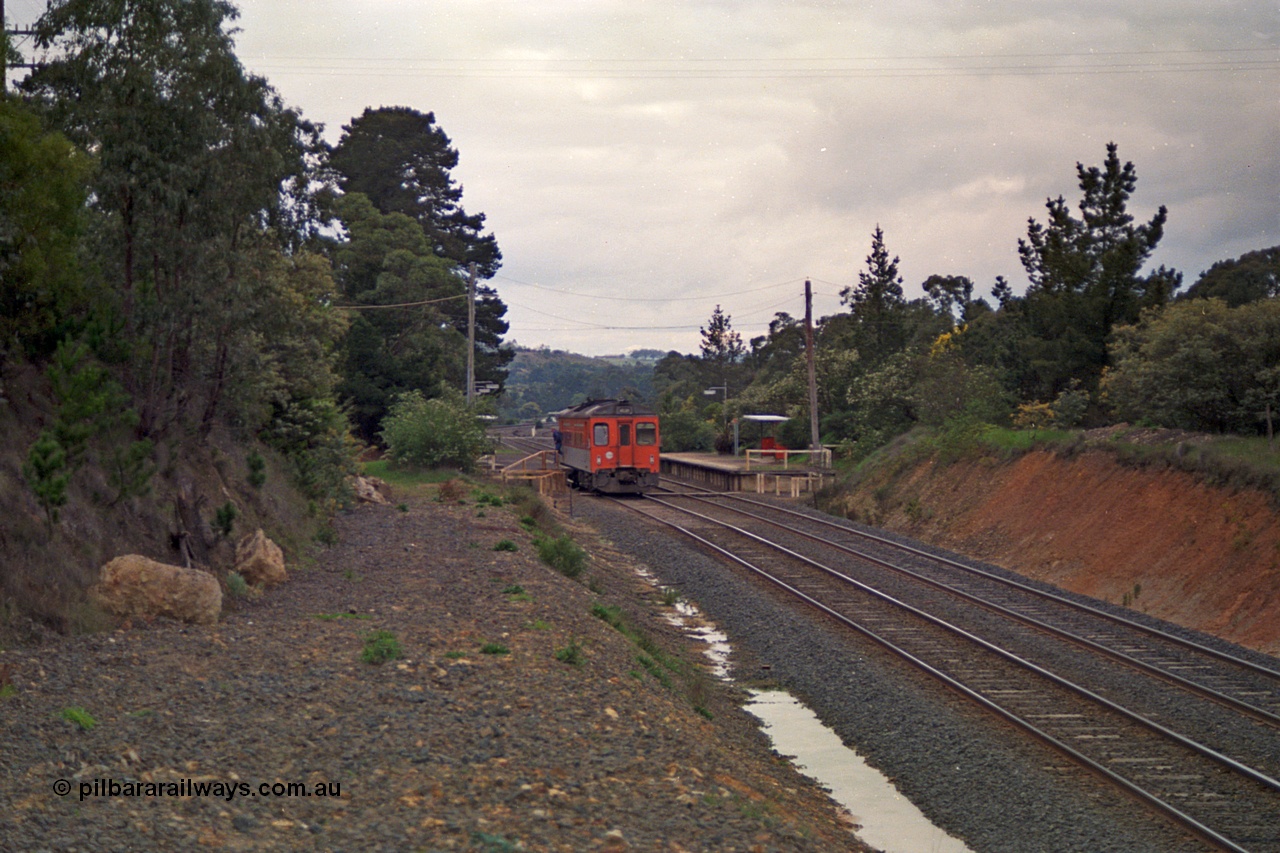 166-20
Heathcote Junction, looking north from the former Heathcote line run-away road, V/Line broad gauge Tulloch Ltd built DRC class diesel rail car has paused at the down platform while operating a Seymour service, the standard gauge line is behind the embankment on the right.
Keywords: DRC-class;Tulloch-Ltd-NSW;