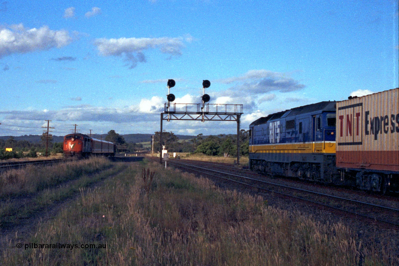 167-04
Wallan Loop, north end, standard gauge NSWSRA 81 class loco 8175 Clyde Engineering EMD model JT26C-2SS serial 85-1094 holds the loop, framed by the signal gantry awaiting a cross with the south bound Inter-Capital Daylight. 8175 is wearing the new Freight Rail 'Stealth' livery.
Keywords: 81-class;8175;Clyde-Engineering-Kelso-NSW;EMD;JT26C-2SS;85-1094;