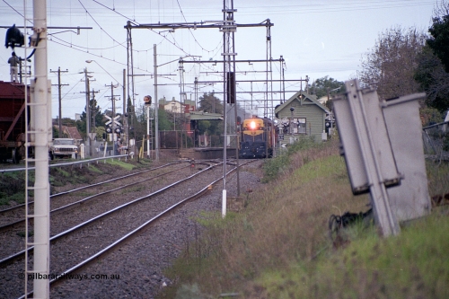 169-01
Spotswood, distant view looking towards Newport, former Victorian Railways and ex. Australian - Portland Cement broad gauge T class locomotive T 413 Clyde Engineering EMD model G8B serial 56-107 leads an up special at the platform, signal box on the right and banner signal U6 on the left with dwarf signal 8 in-between running lines.
Keywords: T-class;T413;Clyde-Engineering-Granville-NSW;EMD;G8B;56-107;