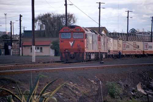 169-02
North Dynon, V/Line broad gauge G class locos G 538 Clyde Engineering EMD model JT26C-2SS serial 89-1271 and a sister have just arrived with 9150 up goods train from Adelaide, second person is winding on hand brakes.
Keywords: G-class;G538;Clyde-Engineering-Somerton-Victoria;EMD;JT26C-2SS;89-1271;