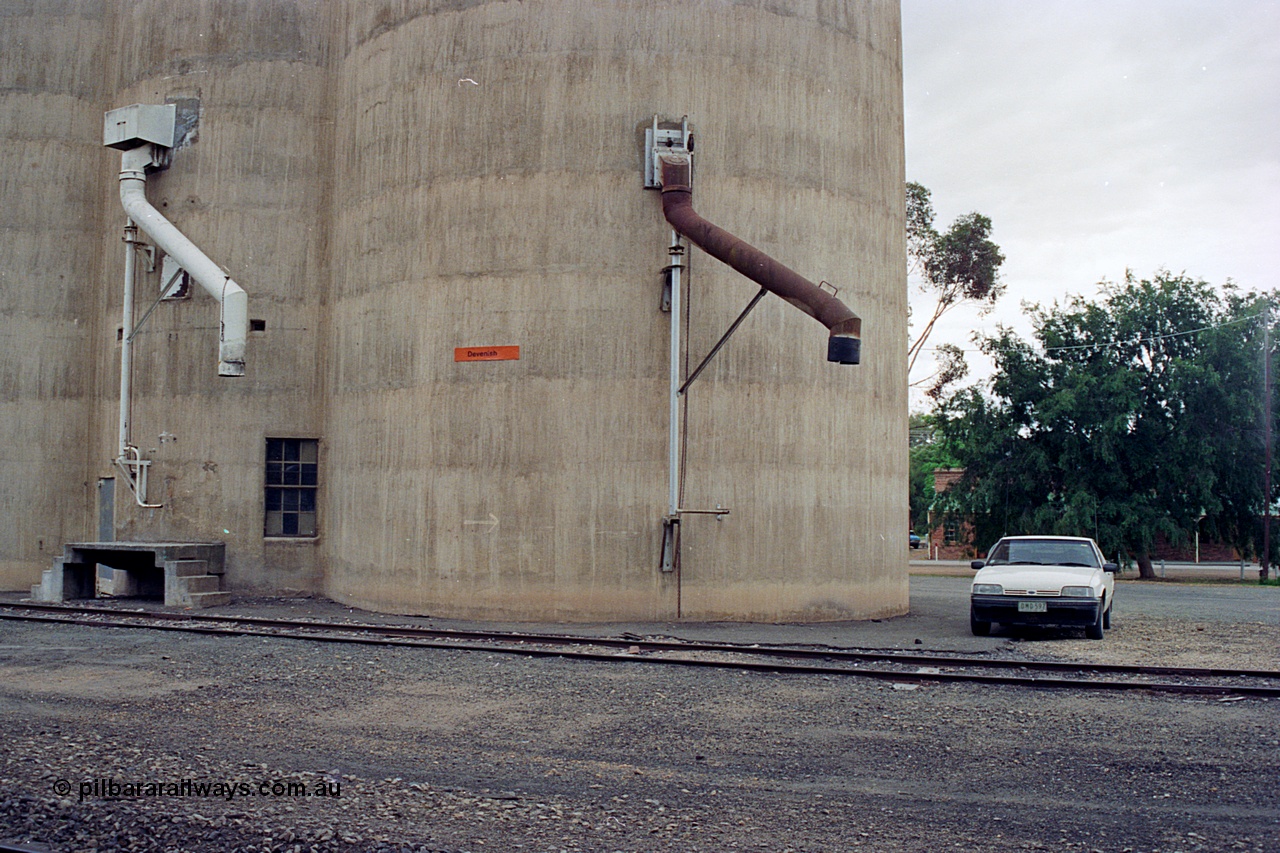 170-12
Devenish, load-out spouts on Williamstown style silo complex, track view, 1988 Ford XF Falcon ute.
