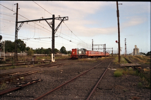 172-06
Sunshine, broad gauge down passenger service lead by a V/Line P class P 17 Clyde Engineering EMD model G18HBR serial 84-1216 rebuilt from T 327 Clyde Engineering EMD model G8B serial 56-78 hauling a 4 car H set, another point of this image is the amount of point rodding running around the place and the standard gauge platform in the background.
Keywords: P-class;P17;Clyde-Engineering-Somerton-Victoria;EMD;G18HBR;84-1216;rebuild;