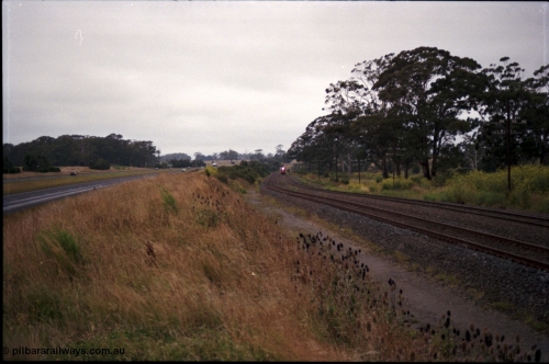 172-10
Bungaree Loop, broad gauge V/Line N class N 453 'City of Albury' a Clyde Engineering EMD model JT22HC-2 serial 85-1221 and N set, Down passenger train.
Keywords: N-class;N453;Clyde-Engineering-Somerton-Victoria;EMD;JT22HC-2;85-1221;