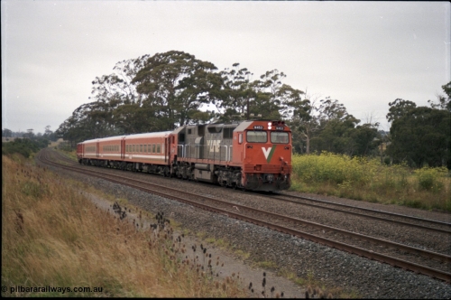 172-11
Bungaree Loop, broad gauge V/Line N class N 453 'City of Albury' a Clyde Engineering EMD model JT22HC-2 serial 85-1221 and N set, down passenger train.
Keywords: N-class;N453;Clyde-Engineering-Somerton-Victoria;EMD;JT22HC-2;85-1221;
