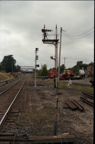 172-22
Ballarat East, semaphore signal post 3, looking east towards Warrenheip, new electric colour light signal post stands at the end of the former Eureka line, Queen Street bridge visible in the background, Ballarat East loco depot on the right.
