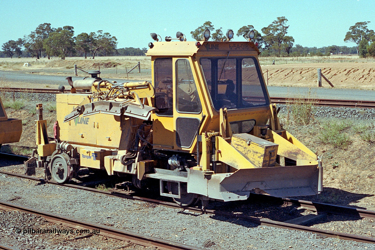 173-08
Murchison East, V/Line broad gauge track machine, asset no. 6-54-018, which is a Tamper BE VR ballast regulator.
Keywords: Tamper;BE-VR;6-54-018;track-machine;
