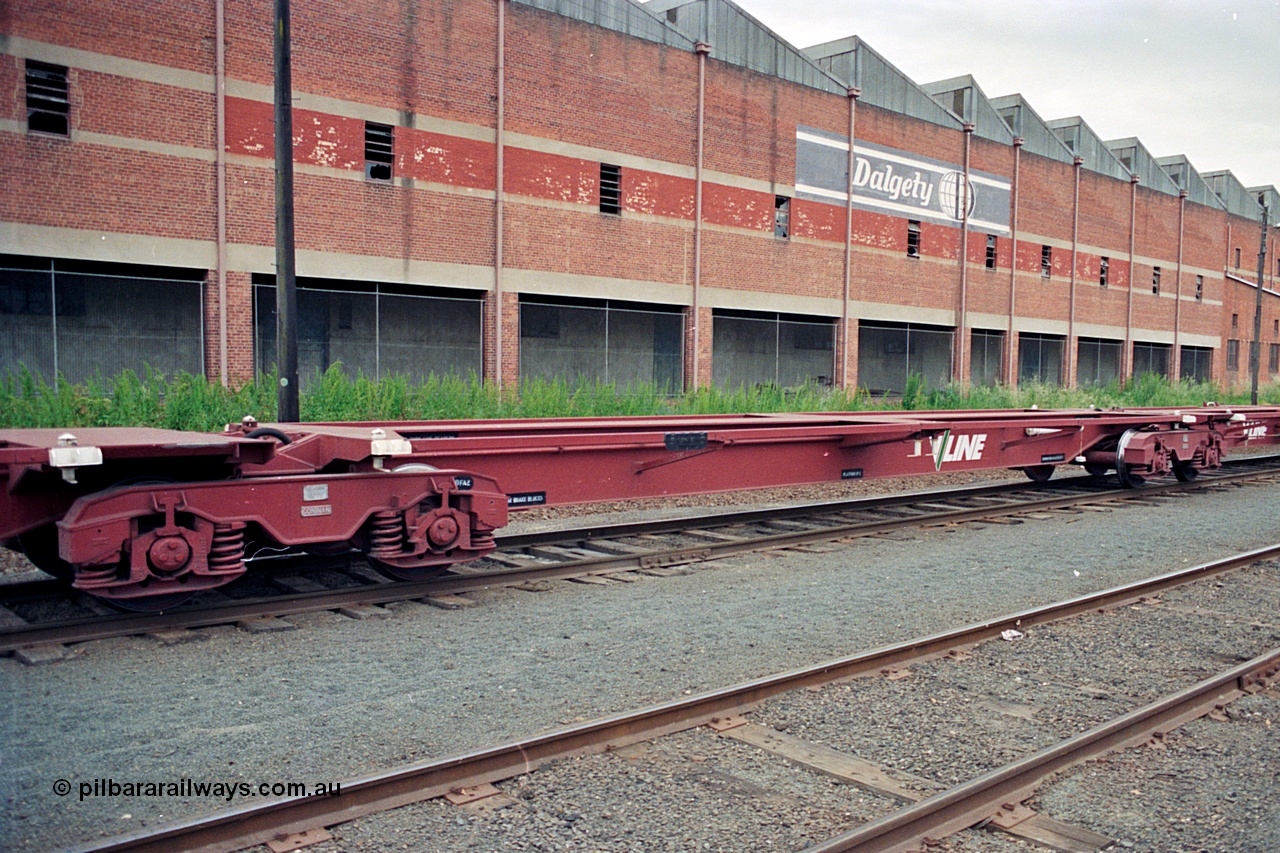 174-19
Albury, V/Line standard gauge VQAW type leader VQAW 1, three pack articulated container waggon with Gloucester bogies, built new at Ballarat North Workshops and issued to traffic 22-11-1990, middle container platform, empty on a south bound goods train, the disused Dalgety's warehouse is behind the waggon.
Keywords: VQAW-type;VQAW1;V/Line-Ballarat-Nth-WS;