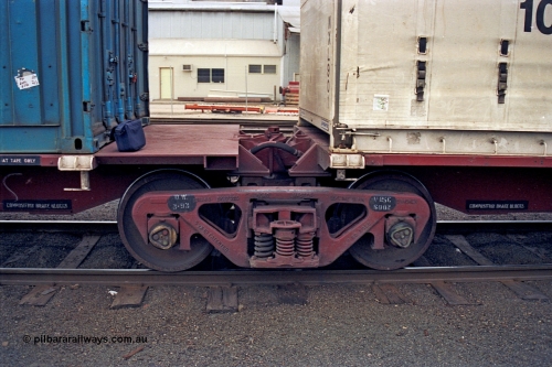 174-15
Albury, V/Line standard gauge Road Master bogie and articulated joint detail of VQAW type VQAW 3 three pack articulated container waggon built by V/Line Ballarat North Workshops and issued to traffic 21-03-1990.
Keywords: VQAW-type;VQAW3;V/Line-Ballarat-Nth-WS;