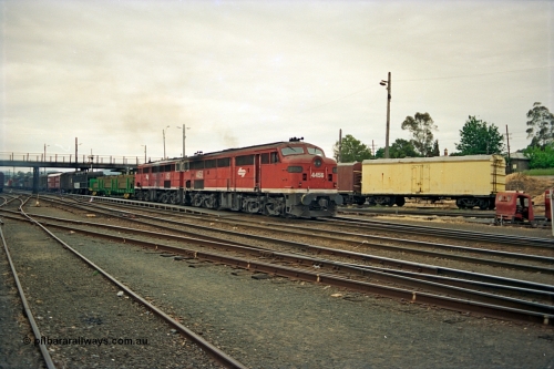 174-23
Albury, yard view from station dock area, NSWSRA standard gauge Red Terror liveried pair of 44 class 4456 AE Goodwin ALCo model DL500B serial 83746 and 4458 AE Goodwin ALCo model DL500B serial 83748 shunt the north with a Melbourne bound goods train.
Keywords: 44-class;4456;AE-Goodwin;ALCo;DL500B;83746;