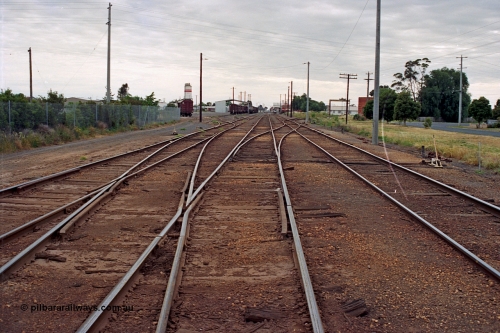 175-12
Shepparton station yard overview looking north, from No.2 Road or mainline, crossover from No.2 to No.1 Road leads into former weighbridge sidings, yard roads 3, 4 and 5 visible at left, also location of cement silos and Freight Gate canopy, station in the distance on the right.
