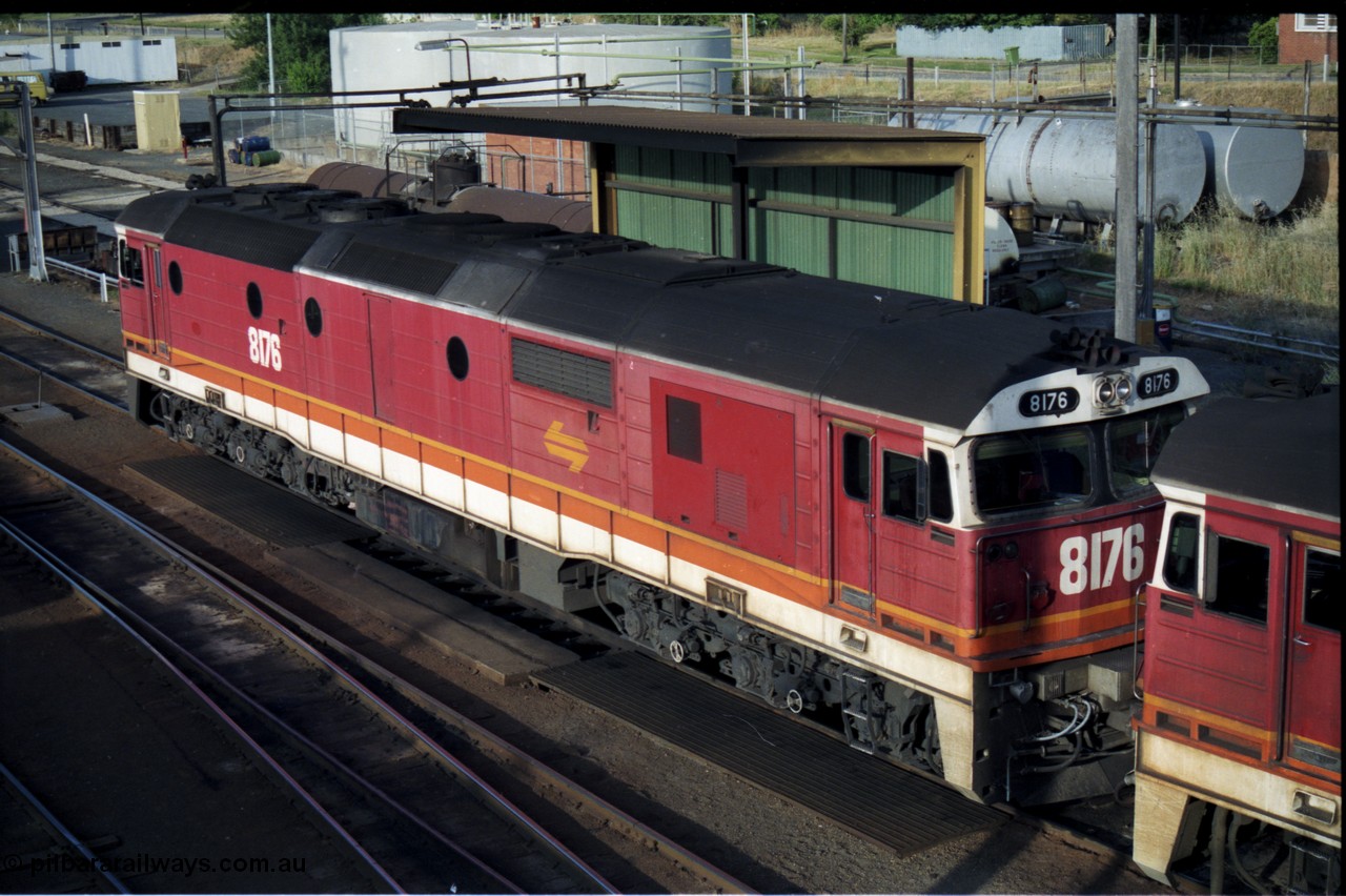176-16
Albury loco depot fuel point, NSWSRA Candy liveried 81 class 8176 Clyde Engineering EMD model JT26C-2SS serial 85-1095, elevated view from the Dean Street road bridge.
Keywords: 81-class;8176;Clyde-Engineering-Kelso-NSW;EMD;JT26C-2SS;85-1095;