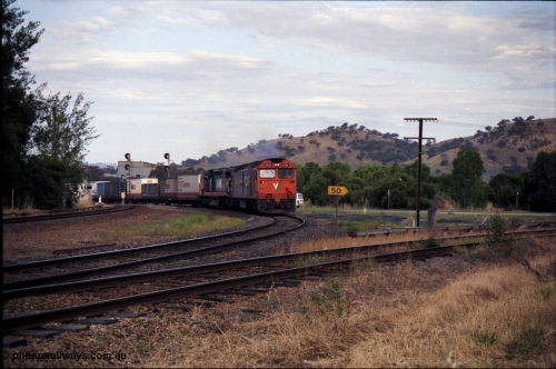 176-11
Wodonga, V/Line standard gauge up goods train passing the Wodonga Coal Sidings behind the G class G 524 Clyde Engineering EMD model JT26C-2SS serial 86-1237 and C class C 505 Clyde Engineering EMD model GT26C serial 76-828 combination, broad gauge track on the left, and the former broad gauge line to Bandiana and Cudgewa curving around to the right.
Keywords: G-class;G524;Clyde-Engineering-Rosewater-SA;EMD;JT26C-2SS;86-1237;