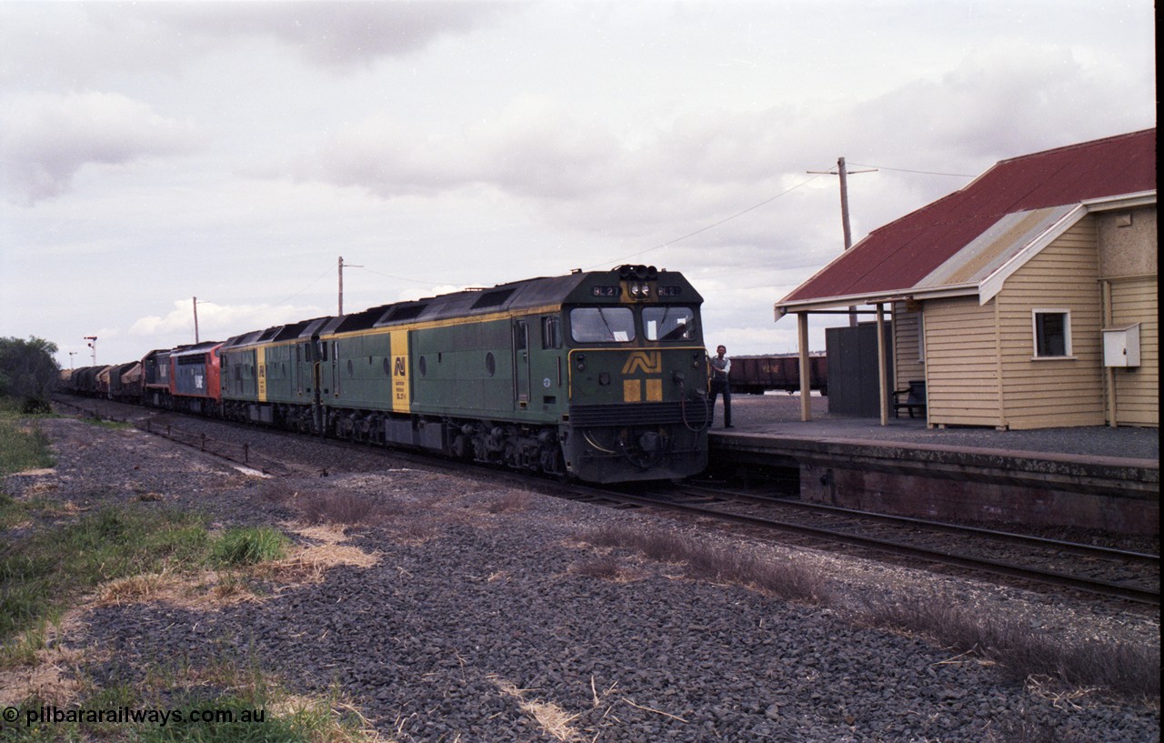 177-17
Gheringhap, down V/Line broad gauge goods train to Adelaide 9169 drifts to a stand as the driver surrenders the electric staff to the signaller for a train order, behind Australian National BL class locomotives BL 27 Clyde Engineering EMD model JT26C-2SS serial 83-1011 and class leader BL 26 'Bob Hawke' serial 83-1010 and V/Line S class S 313 'Alfred Deakin' Clyde Engineering EMD model A7 serial 61-230 and X class X 53 Clyde Engineering EMD model G26C serial 75-800.
Keywords: BL-class;BL27;Clyde-Engineering-Rosewater-SA;EMD;JT26C-2SS;88-1011;