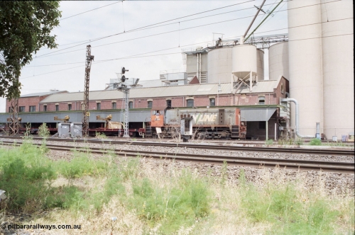 177-08
Newport Junction, V/Line broad gauge shunt locomotive Y class Y 130 Clyde Engineering EMD model G6B serial 65-396 leads a rail recovery train of VZRF class bogie welded rail transport waggons, along the Newport - Sunshine Loop Line in front of the Victorian Oatgrowers Pool Siding.
Keywords: Y-class;Y130;Clyde-Engineering-Granville-NSW;EMD;G6B;65-396;